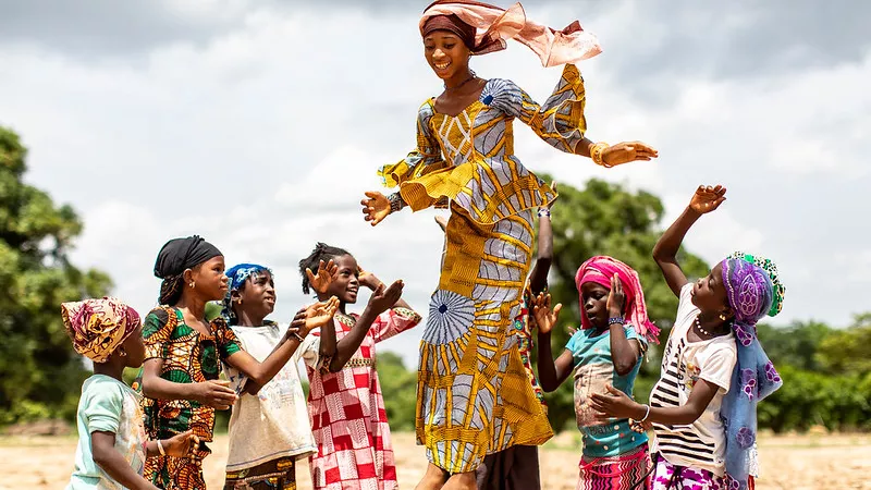 Young women surrounded by girls in Africa