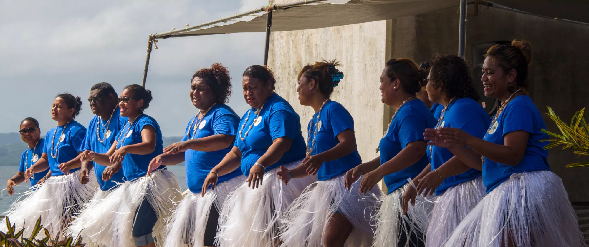 Dancing the traditional Palau dance under the Koror-Babeldaob bridge in Palau