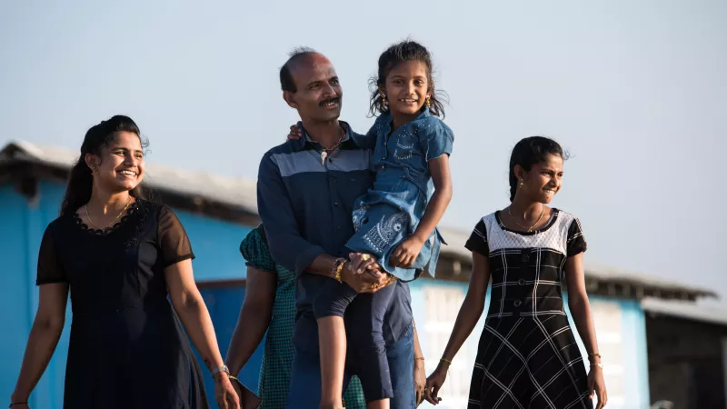 a family looks towards the ocean