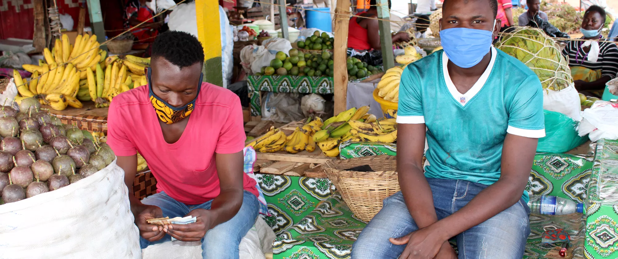 portrait of two men at a market