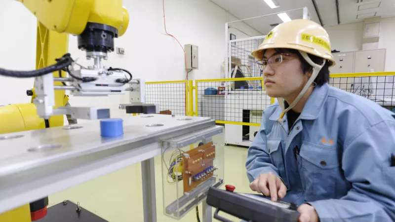 Student learning robotics at a vocational training school in Japan.