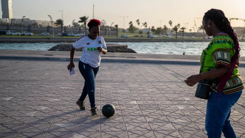 women playing football