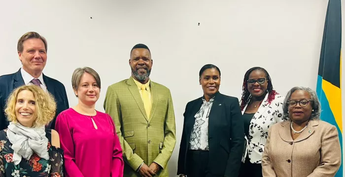 Dr. Joni Musabayana, ILO Caribbean Office's Director, centre, with other ILO Officials and the Bahamas team