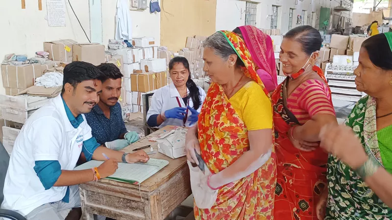 Workers getting registration done at a service centre