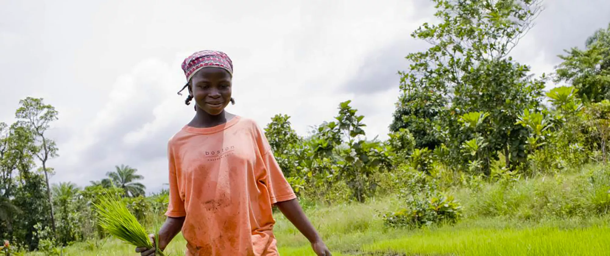 Young female in a field in Liberia