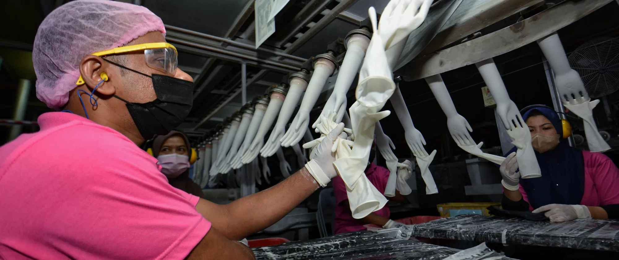 A worker in a Malaysian latex glove factory