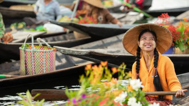 Selling flowers at Inle lake floating market in Shan State of Myanmar