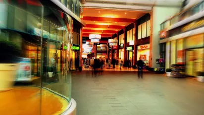 Inside picture of a mall with different shops