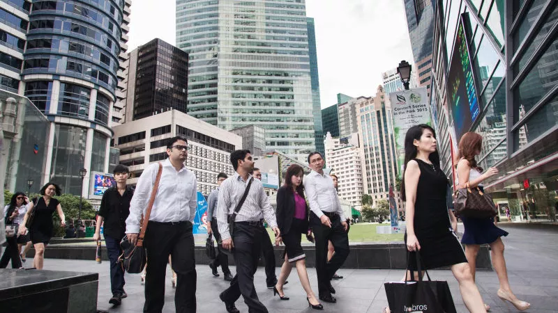 Office workers heading for work in Singapore