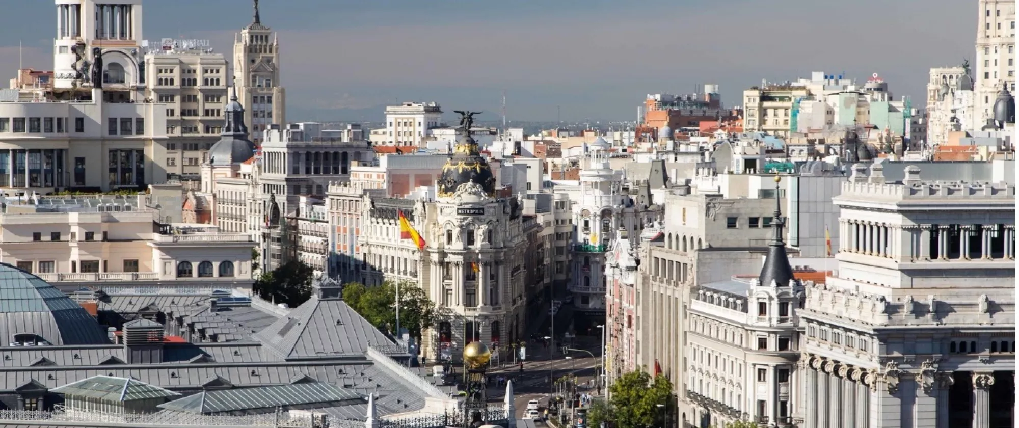 Landscape picture of Madrid featuring the Metrópolis building on the Gran Vía.