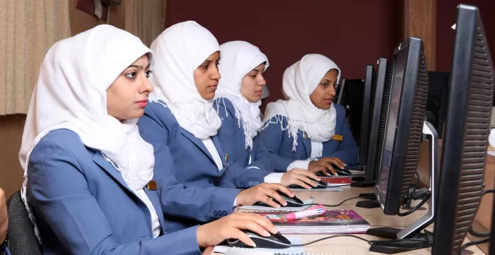 Women following a training on computers