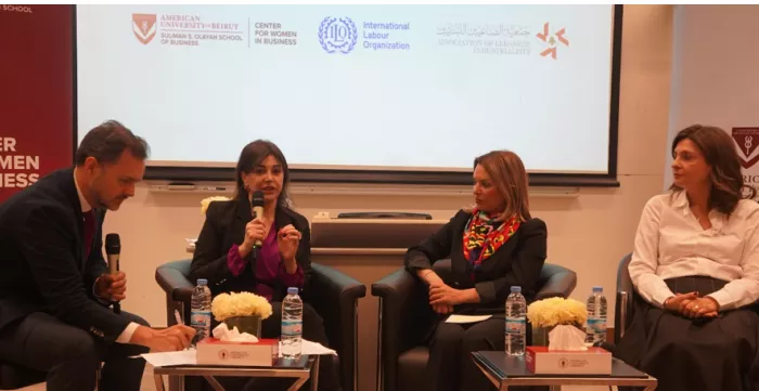 A man and three women sit at a panel discussion in Lebanon